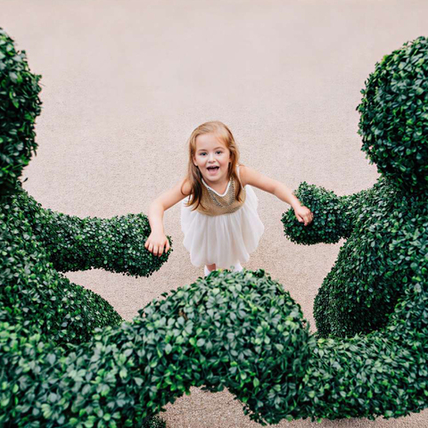 The Human Hedges making friends at a wedding in London.